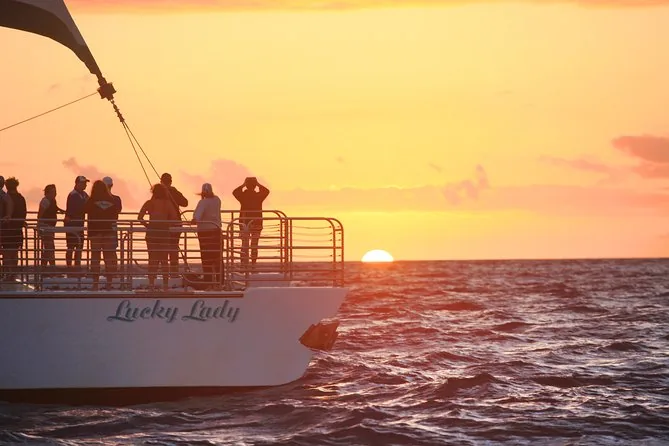 Catamaran off the Na Pali Coast at sunset